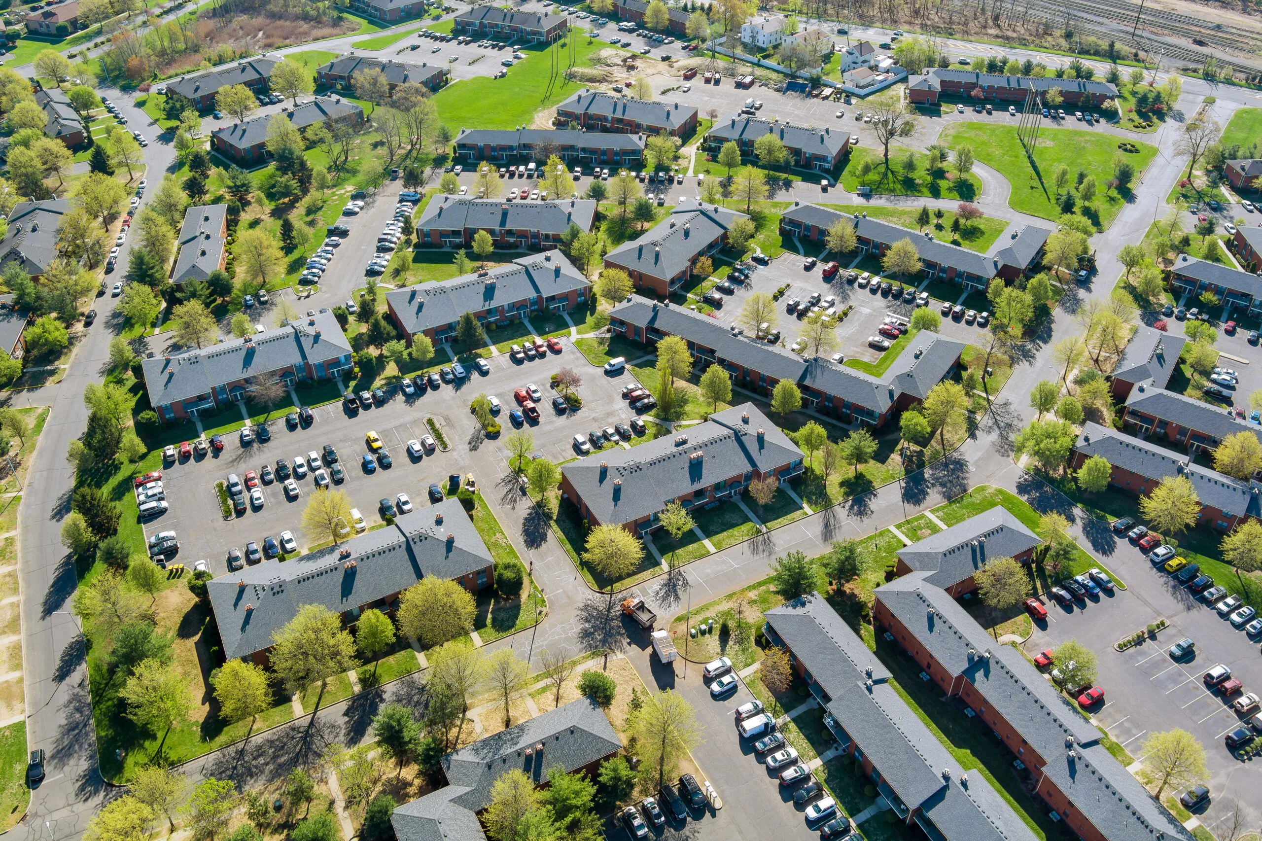 Exterior view small Michigan town residential apartment complex in street and home